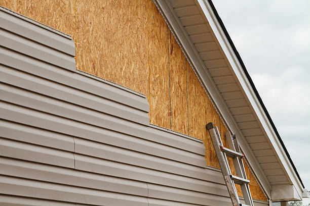 Professional Siding technician working in Burlington, MA